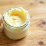 Glass jar with beef tallow | Franklin Dermatology